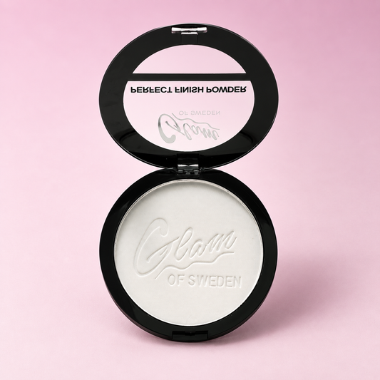 Perfect Finish Powder Clear H01485 — boîtier ouvert sur fond rose