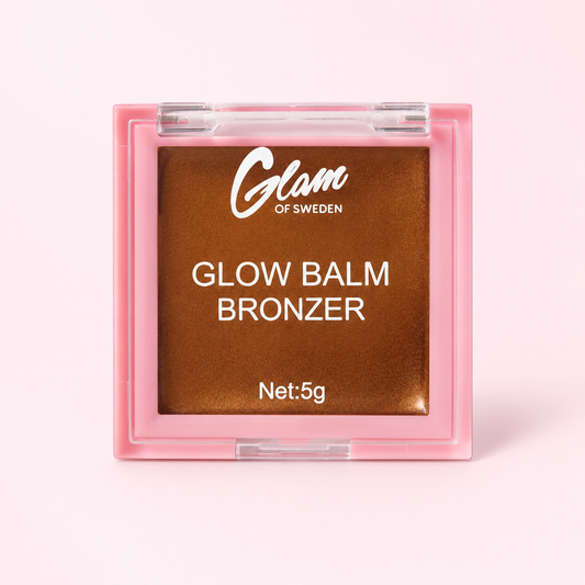 Glow Balm Bronzer — Baume bronzant — Honey Soda sur fond rose clair